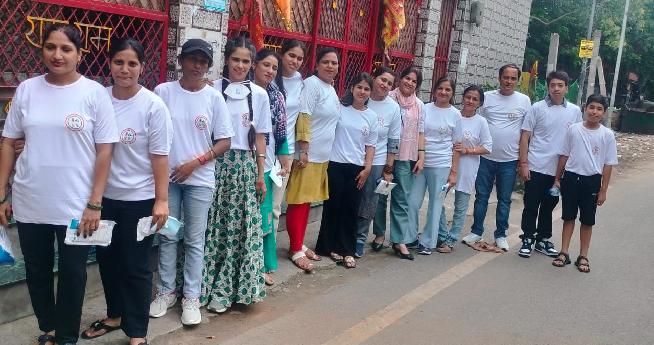 Community members planting trees together.